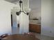 Dining room with a chandelier and wood table at 3626 E Thunderhill Pl, Phoenix, AZ 85044