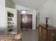 Inviting entryway with built-in shelves and double doors at 3626 E Thunderhill Pl, Phoenix, AZ 85044