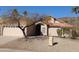 Tan stucco house with tile roof, arched entryway, and two-car garage at 3626 E Thunderhill Pl, Phoenix, AZ 85044