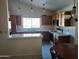 Efficient kitchen with wood cabinets and tile countertops at 3626 E Thunderhill Pl, Phoenix, AZ 85044