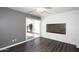 Bedroom with wood-look flooring, sliding door to patio, and wall-mounted decor at 3928 N Granite Reef Rd, Scottsdale, AZ 85251