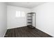 Well-lit bedroom featuring dark floors and a freestanding clothing rack at 3928 N Granite Reef Rd, Scottsdale, AZ 85251