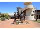 Courtyard with sculptures and a spiral staircase at 3928 N Granite Reef Rd, Scottsdale, AZ 85251