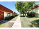 Neatly landscaped walkway leads to charming condo building with terracotta roofs at 3928 N Granite Reef Rd, Scottsdale, AZ 85251