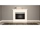 White fireplace in living room with wood-look floors at 3928 N Granite Reef Rd, Scottsdale, AZ 85251