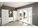 Laundry area with white cabinets and French doors leading to patio at 3928 N Granite Reef Rd, Scottsdale, AZ 85251