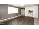 Living room with wood-look floors and view to entryway at 3928 N Granite Reef Rd, Scottsdale, AZ 85251