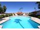 Community pool with surrounding patio and palm trees at 3928 N Granite Reef Rd, Scottsdale, AZ 85251