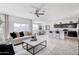 Open concept kitchen with island, stainless steel appliances, and dark cabinets at 5099 E Umber Rd, San Tan Valley, AZ 85143