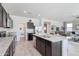 Open concept kitchen with island and pantry at 5099 E Umber Rd, San Tan Valley, AZ 85143