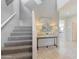 Modern staircase with grey carpet and contemporary console table at 5099 E Umber Rd, San Tan Valley, AZ 85143