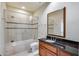 Bathroom with a tub, shower, and dark vanity at 5635 W Melinda Ln, Glendale, AZ 85308