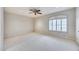 Bright bedroom with ceiling fan and window shutters at 5635 W Melinda Ln, Glendale, AZ 85308