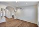 Formal dining room with hardwood floors and arched entryway at 5635 W Melinda Ln, Glendale, AZ 85308