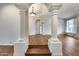 Elegant entryway with hardwood floors and arched columns at 5635 W Melinda Ln, Glendale, AZ 85308