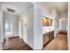 Hallway with built-in wet bar and hardwood floors at 5635 W Melinda Ln, Glendale, AZ 85308