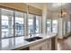 Kitchen with a sink, white cabinets, and stunning water views at 5635 W Melinda Ln, Glendale, AZ 85308