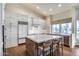 Modern kitchen with center island, white cabinets, and hardwood floors at 5635 W Melinda Ln, Glendale, AZ 85308