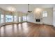 Large living room featuring hardwood floors, a fireplace, and lots of natural light at 5635 W Melinda Ln, Glendale, AZ 85308