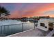 Lakefront patio with fireplace and captivating sunset view at 5635 W Melinda Ln, Glendale, AZ 85308