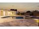 A backyard pool and outdoor deck, seen at dusk at 6331 E Earll Dr, Scottsdale, AZ 85251