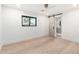 Open bedroom with a barn door leading to an en-suite bathroom at 6331 E Earll Dr, Scottsdale, AZ 85251