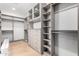 Spacious walk-in closet features custom shelving and ample storage at 6331 E Earll Dr, Scottsdale, AZ 85251