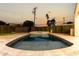 Wide angle view of the pool and backyard as the sun is setting at 6331 E Earll Dr, Scottsdale, AZ 85251