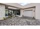 Elegant entry with stonework, water feature, and glass doors at 7153 E Ironwood Dr, Paradise Valley, AZ 85253