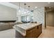 Open kitchen with marble countertops and a built-in wine cooler at 7153 E Ironwood Dr, Paradise Valley, AZ 85253