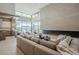 Living room with large sectional sofa and linear fireplace at 7153 E Ironwood Dr, Paradise Valley, AZ 85253