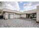 Spacious motorcourt with three-car garage and pavers at 7153 E Ironwood Dr, Paradise Valley, AZ 85253