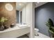 Elegant powder room with modern vanity and fixtures at 7153 E Ironwood Dr, Paradise Valley, AZ 85253