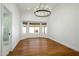 Bright dining room with hardwood floors, a chandelier, and a bay window at 7390 E Hanover Way, Scottsdale, AZ 85255