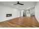 Spacious living room featuring hardwood floors, a fireplace, and an open-concept design at 7390 E Hanover Way, Scottsdale, AZ 85255