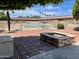 Community pool and fire pit area with paved patio at 7750 E Broadway Rd # 860, Mesa, AZ 85208