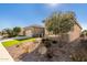 House exterior showcasing landscaping and architectural details at 7815 W Cinder Brook Way, Florence, AZ 85132