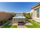 Modern hot tub with steps in a landscaped backyard at 7815 W Cinder Brook Way, Florence, AZ 85132