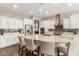 Modern kitchen with granite countertops and stainless steel appliances at 7815 W Cinder Brook Way, Florence, AZ 85132