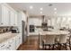 Modern kitchen with granite countertops and white cabinets at 7815 W Cinder Brook Way, Florence, AZ 85132