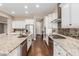 Spacious kitchen with granite countertops, stainless steel appliances, and ample cabinetry at 7815 W Cinder Brook Way, Florence, AZ 85132