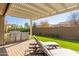 Outdoor kitchen with grill and pergola at 7815 W Cinder Brook Way, Florence, AZ 85132