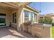 Stainless steel outdoor kitchen with grill and side burner at 7815 W Cinder Brook Way, Florence, AZ 85132