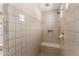 Large walk-in shower with tiled walls and built-in seat at 7815 W Cinder Brook Way, Florence, AZ 85132