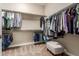 Spacious walk-in closet with ample shelving and hanging space at 7815 W Cinder Brook Way, Florence, AZ 85132