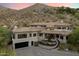 Modern home with a circular driveway and desert landscaping at 8150 N 47Th St, Paradise Valley, AZ 85253