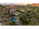 Stunning aerial view of home with pool and mountain views at 8150 N 47Th St, Paradise Valley, AZ 85253