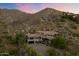 Luxury home nestled on a hillside with a large garage at 8150 N 47Th St, Paradise Valley, AZ 85253