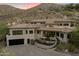 Modern home with a circular driveway and desert landscaping at 8150 N 47Th St, Paradise Valley, AZ 85253