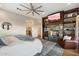 Spacious bedroom with fireplace and built-in shelving at 8150 N 47Th St, Paradise Valley, AZ 85253